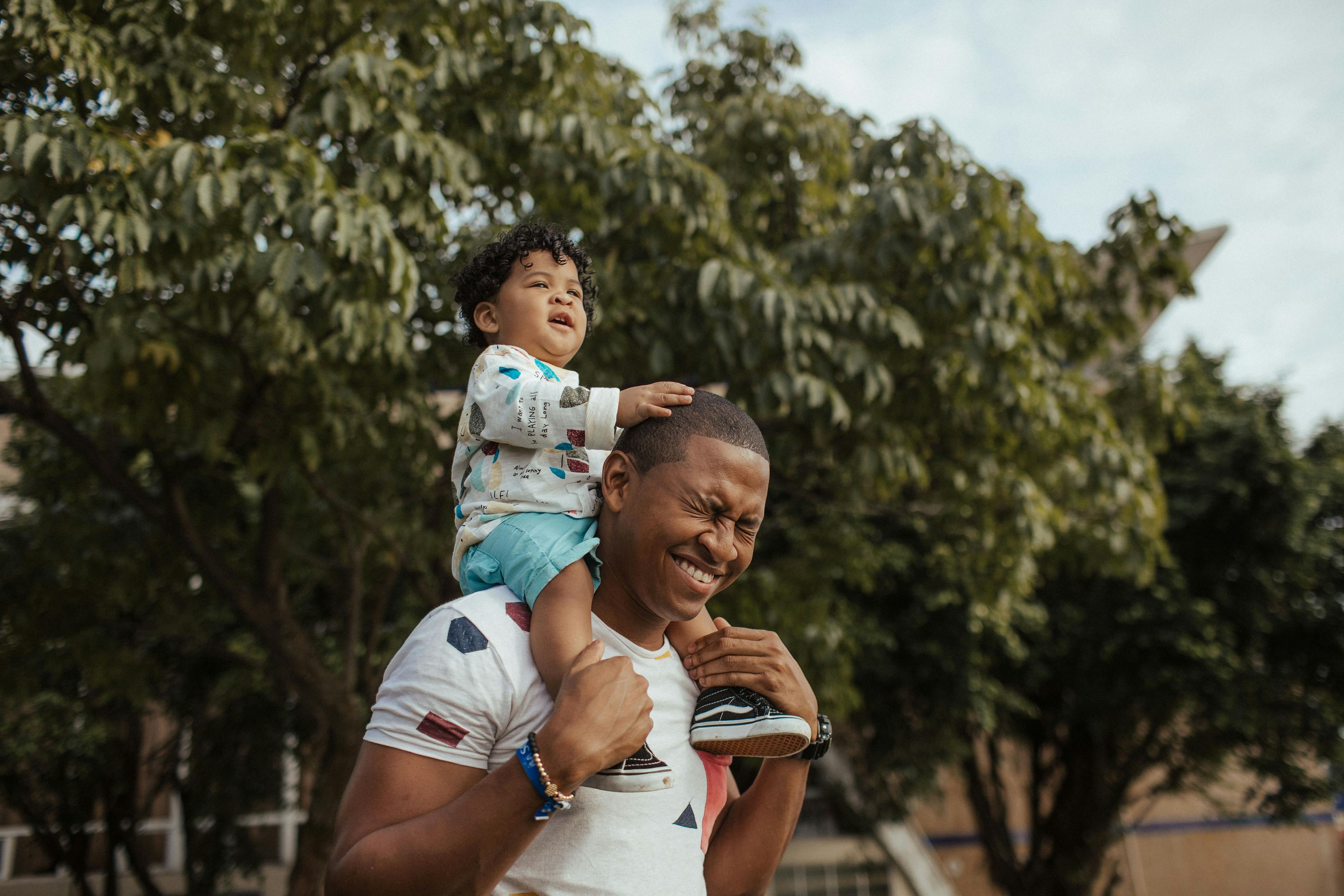 Man Carrying Child 