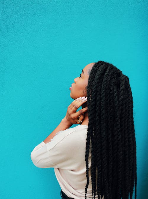 Free Woman Holding Neck Staring On Wall Stock Photo