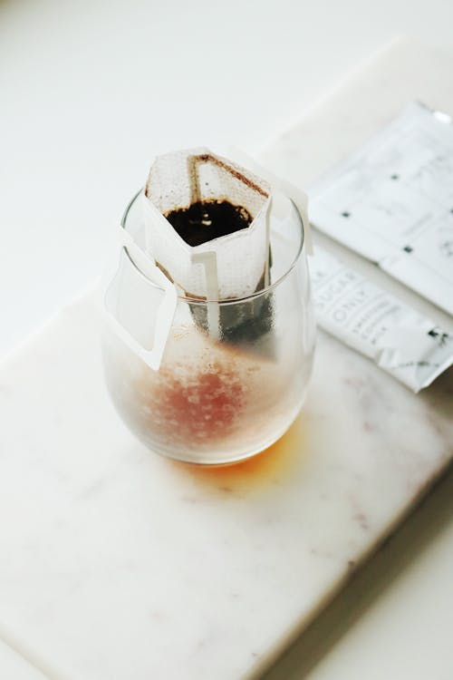 Tea Bag in Clear Glass Cup