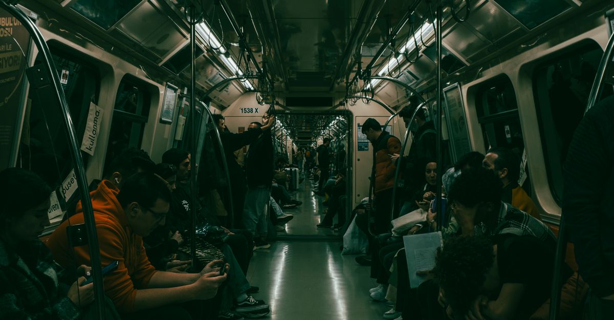 People Using Train People on a Train · Free Stock Photo