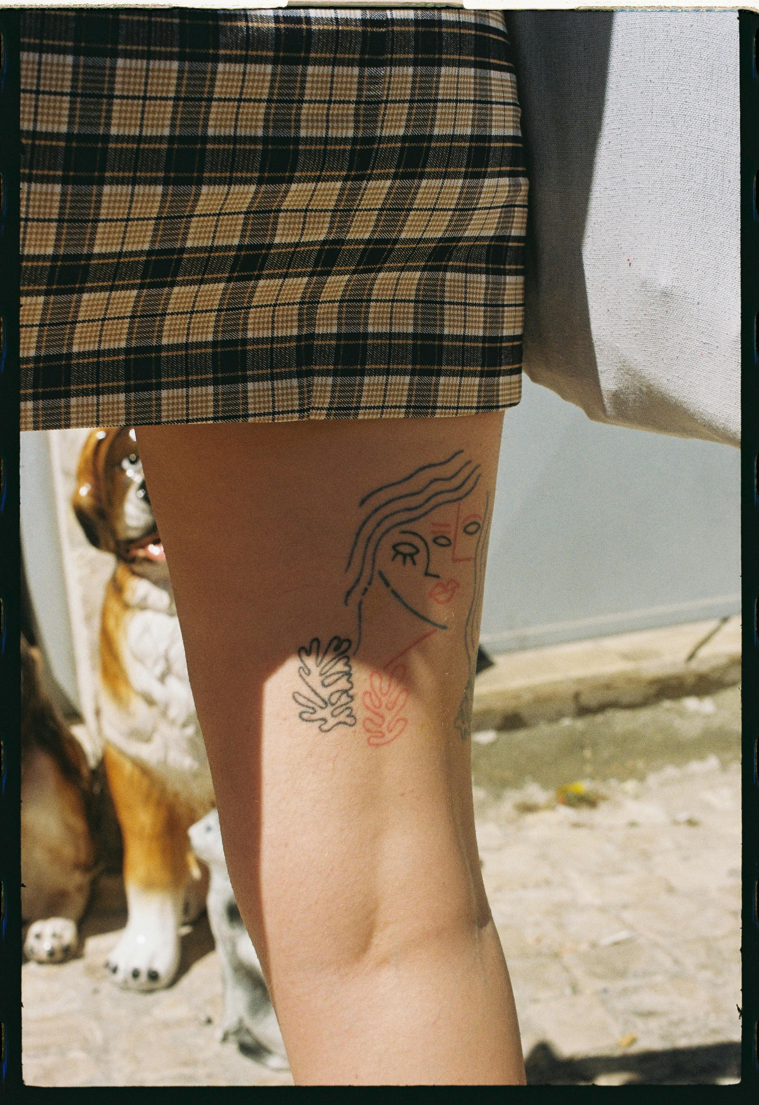 free photo of a tattoo on womans thigh