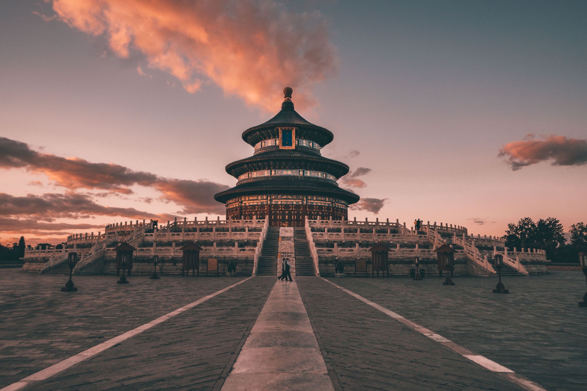 Stunning view of the Temple of Heaven in Beijing under a vibrant sunset sky.