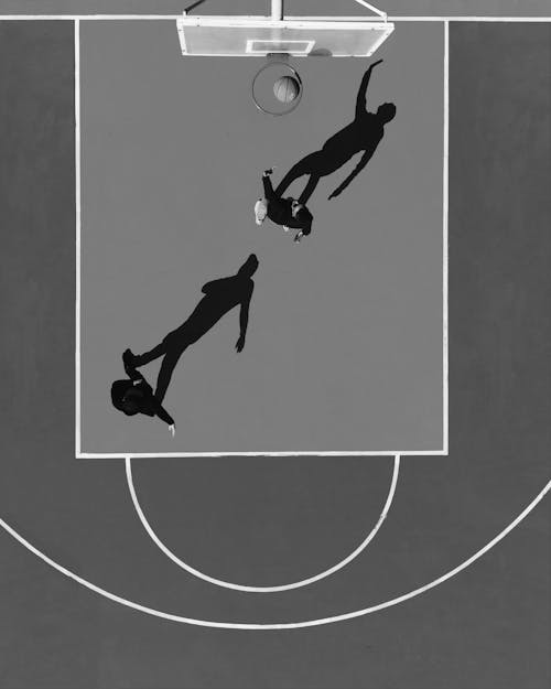 Top View of Men Playing Basketball in Black and White