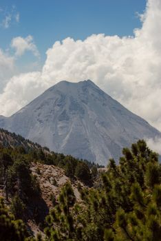 Capture of the Volcán de Colima with lush pine forests in Ciudad Guzman, Mexico.
