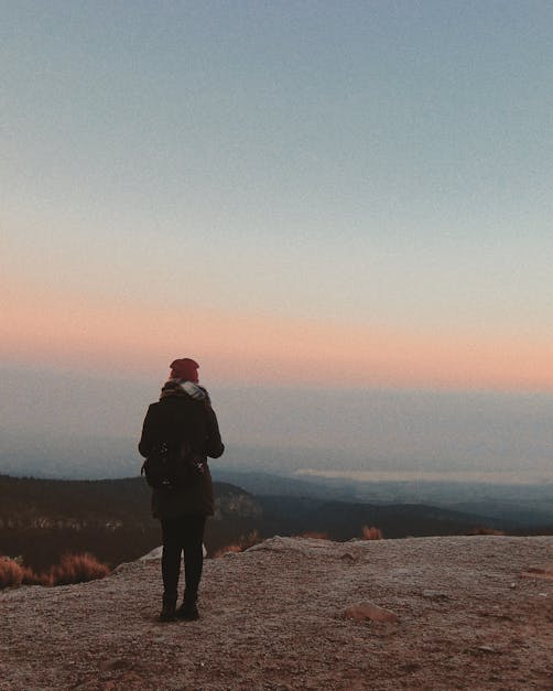 Woman Standing Near Cliff · Free Stock Photo