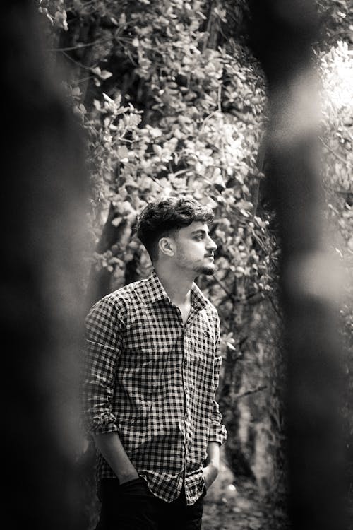 Man Posing in Shirt in Black and White