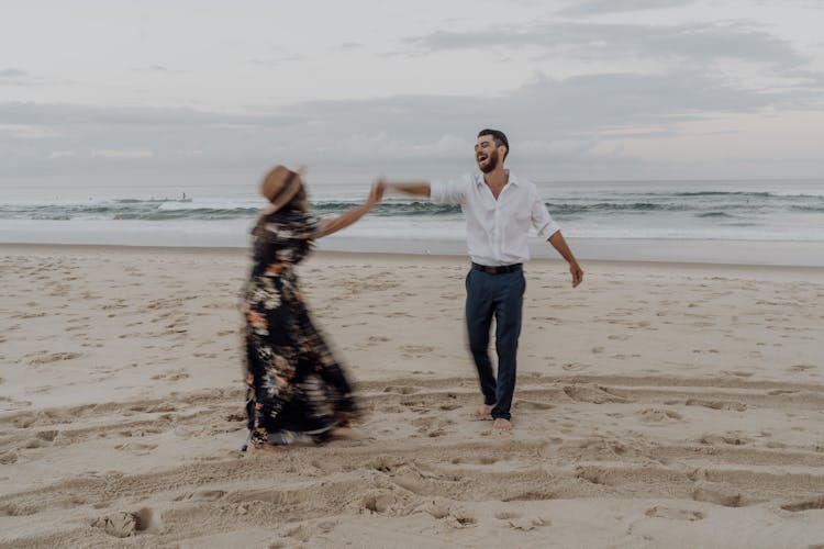 Couple Dancing On Beach