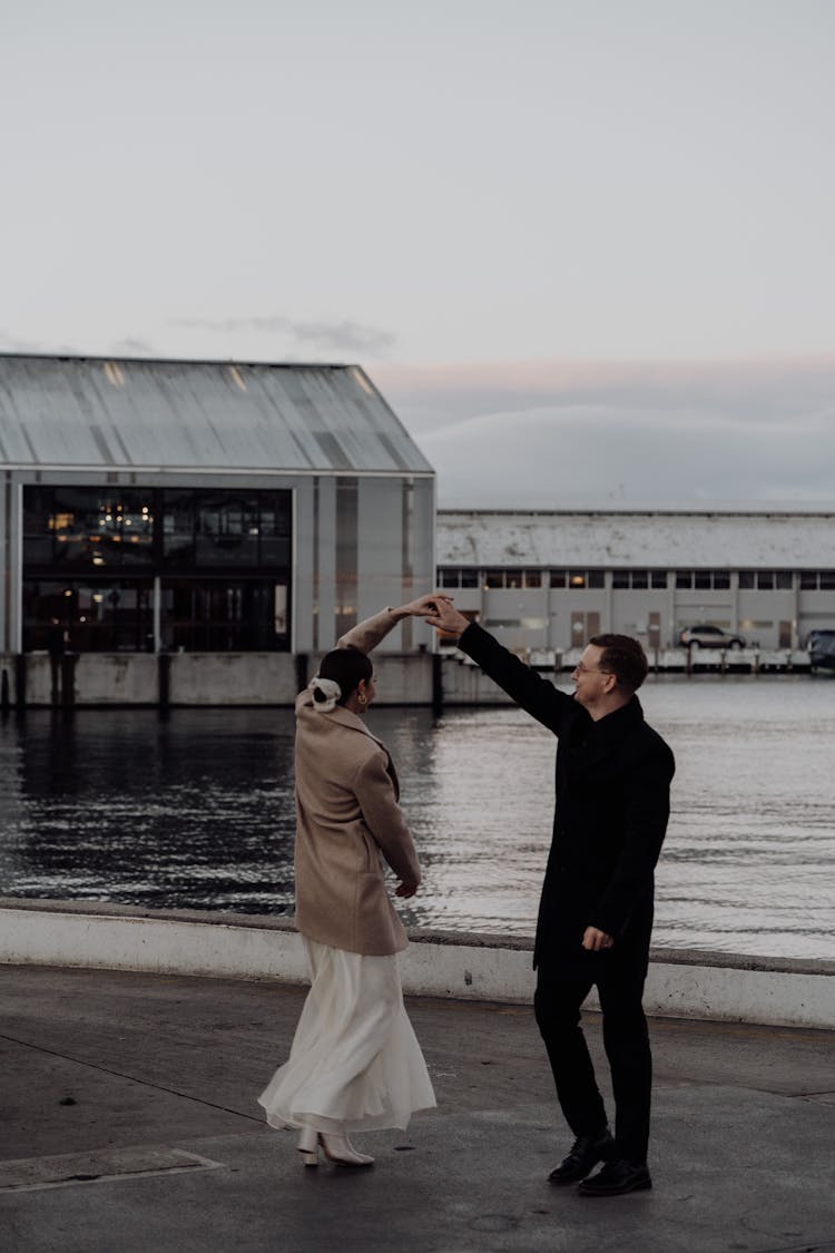 Newlywed Couple Dancing In Bay