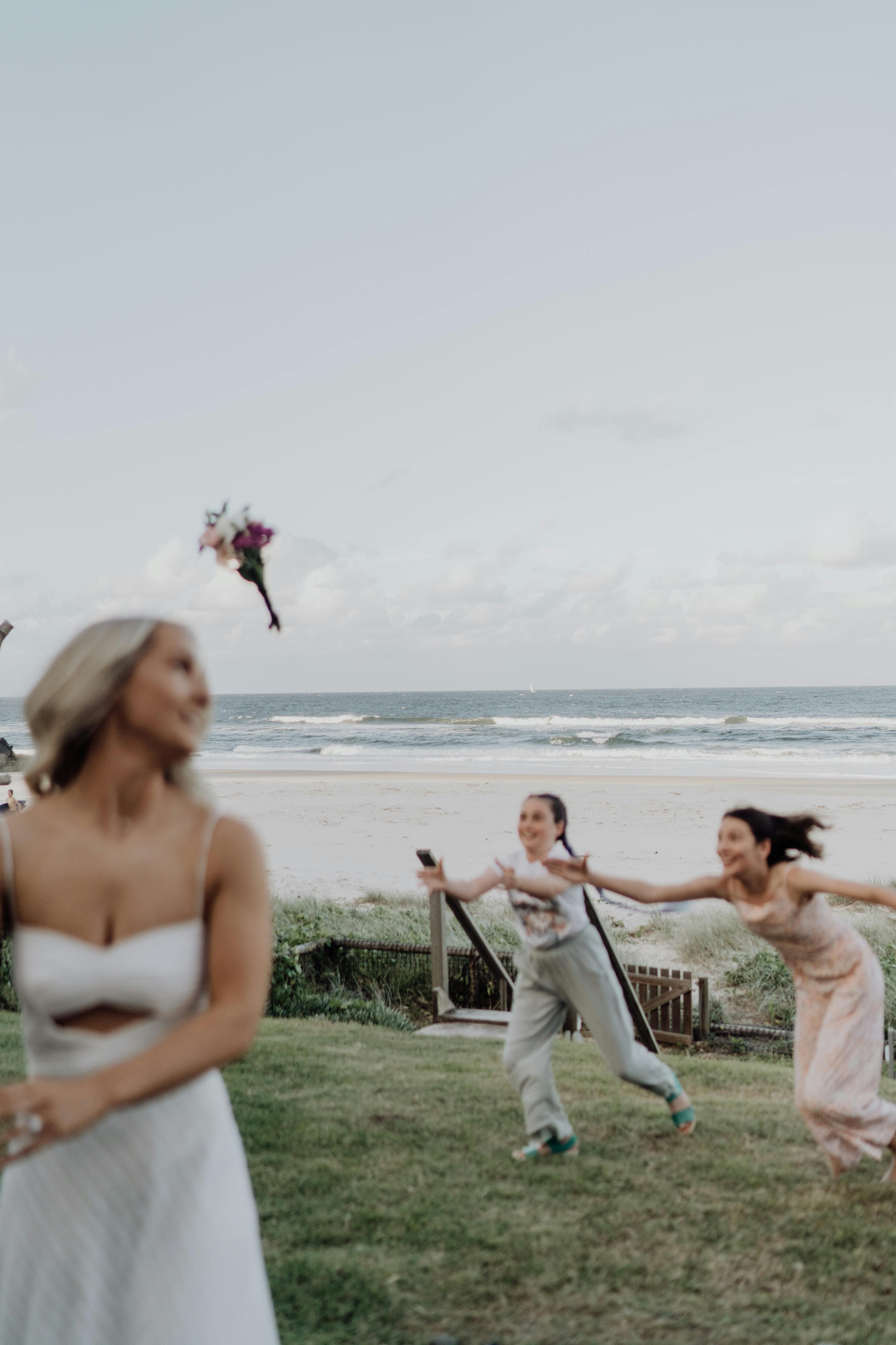 Bride and groom throwing flowers at each other · Free Stock Photo