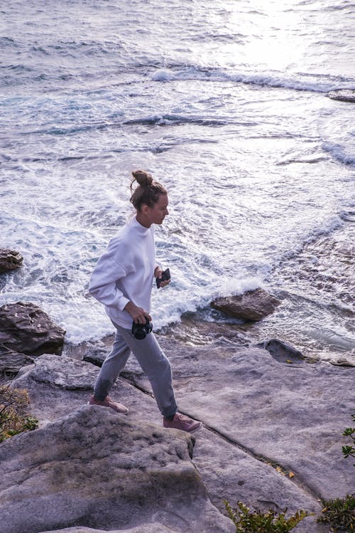 Free Photo of Woman Walking Near Ocean Stock Photo