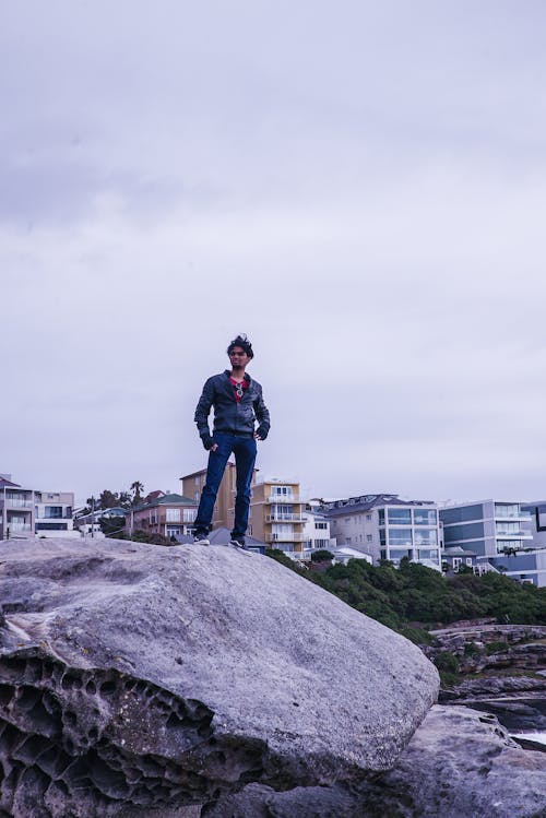 Man Standing on Gray Rock