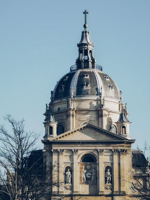 Free Elegant view of Sorbonne Chapel's architectural dome in Paris, featuring classic detailed sculptures. Stock Photo