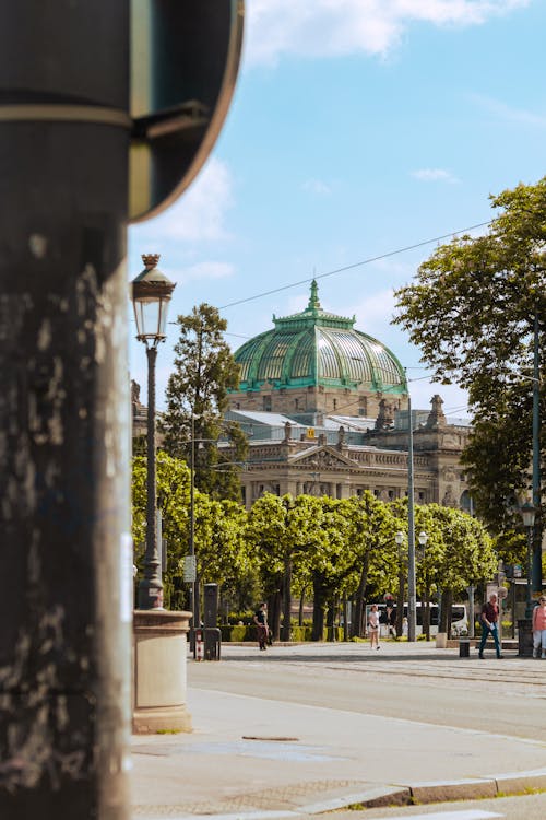 Dome of Berlin Cathedral over Trees and Street
