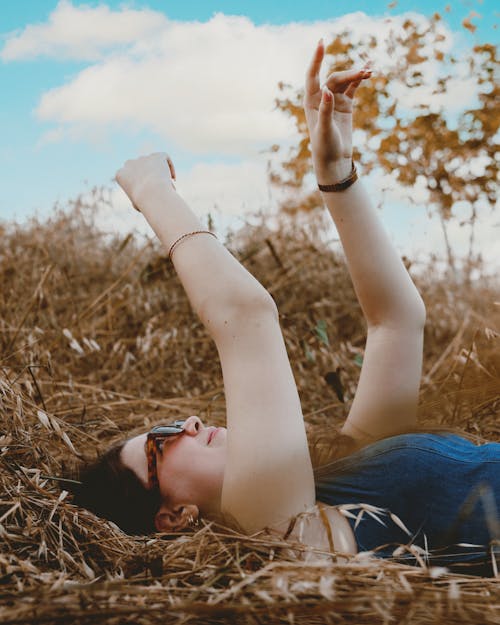 Brunette Relaxing in Countryside