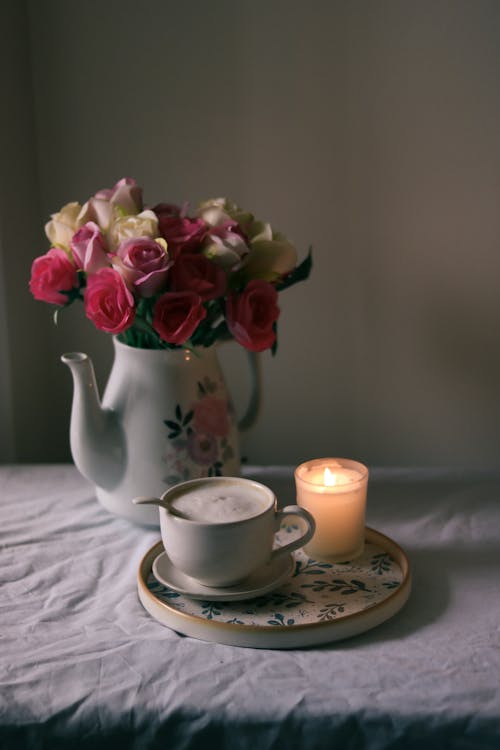 Coffee and Candle on Table