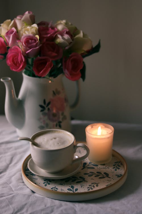 Coffee Cup and Candle on Plate