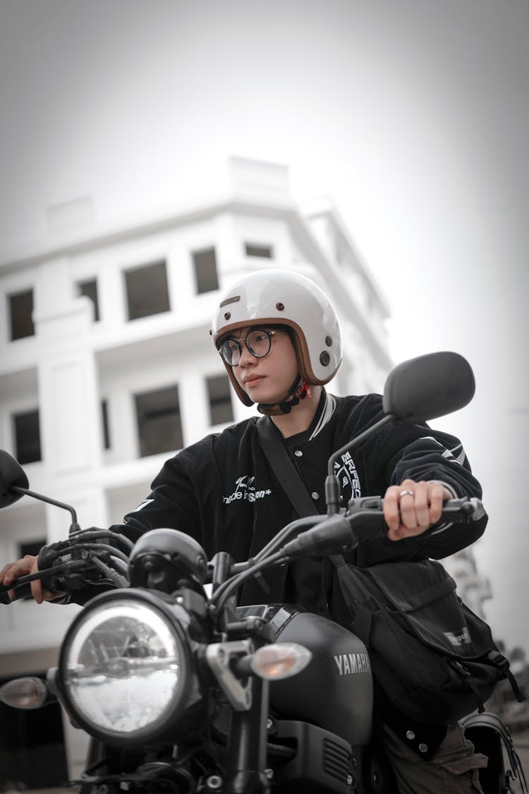 Young Man On A Motorcycle In City 