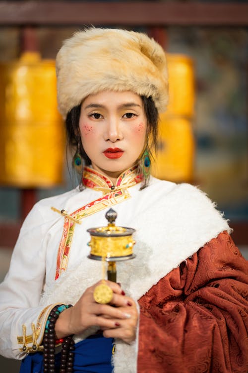 Woman in Traditional Clothing and Hat