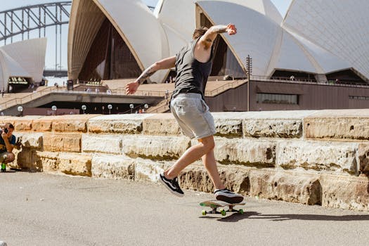 A skateboarder executing a trick in front of the Sydney Opera House, capturing urban excitement.