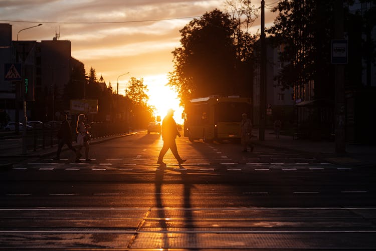 Sunlight Over People Crossing Street