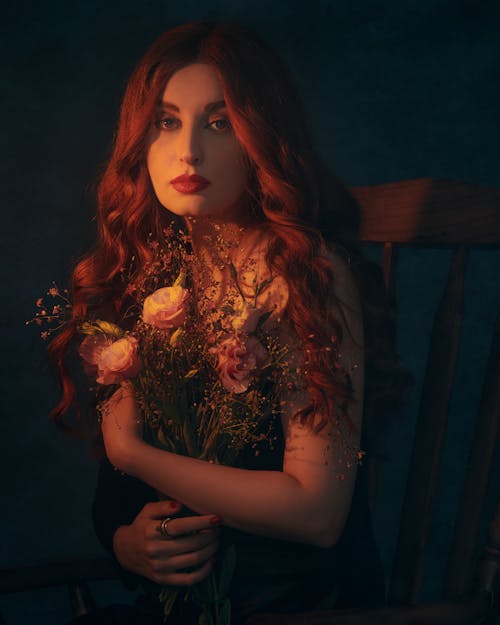 Portrait of Woman Sitting with Flowers Bouquet