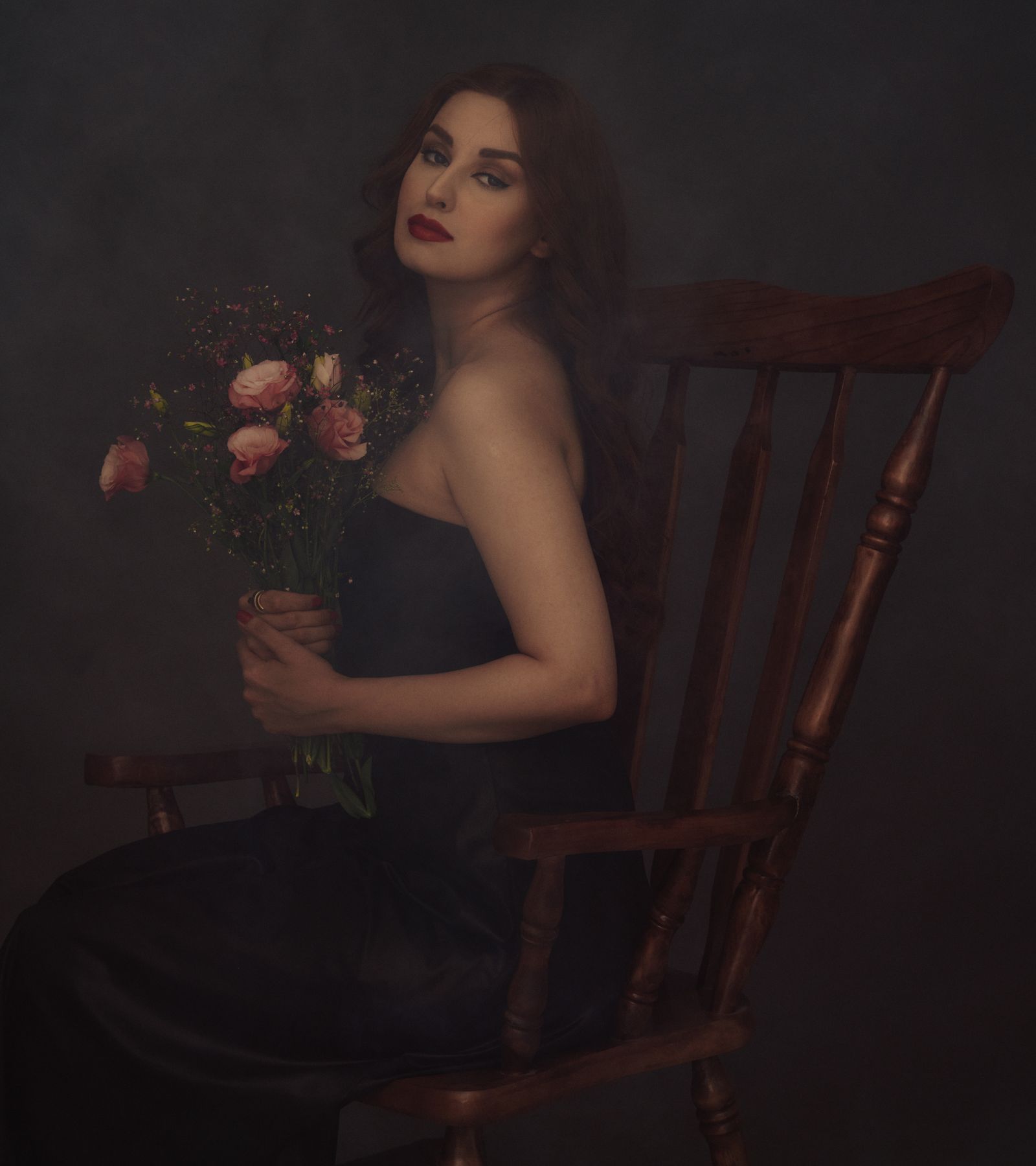 Editorial portrait of a woman with roses