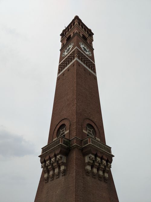 Free Low angle shot of the iconic Husainabad Clock Tower under an overcast sky in Lucknow, India. Stock Photo