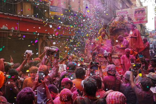 Free A lively Holi festival scene in Kolkata, India filled with vibrant colors and joyous celebrations. Stock Photo