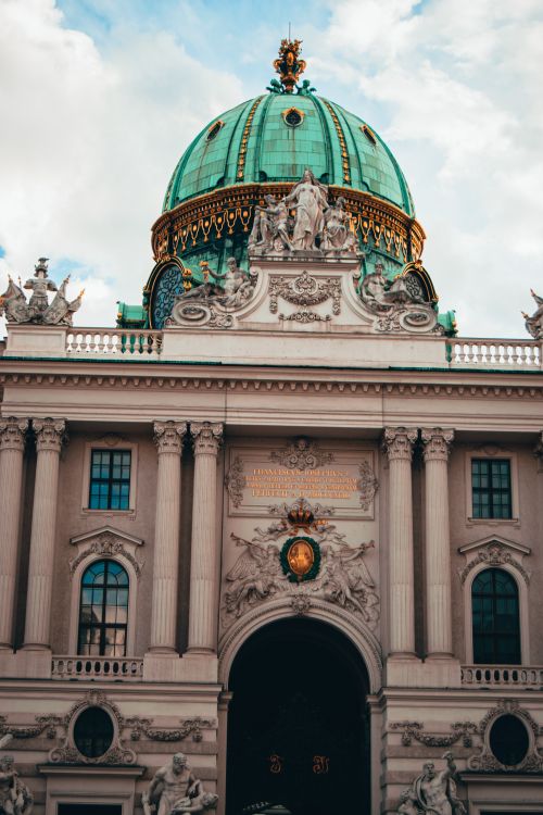 Free Ornate dome of Hofburg Palace in Vienna, a historic landmark and popular travel destination. Stock Photo