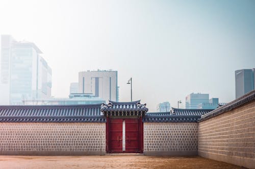 Slightly Open Red Metal Gate