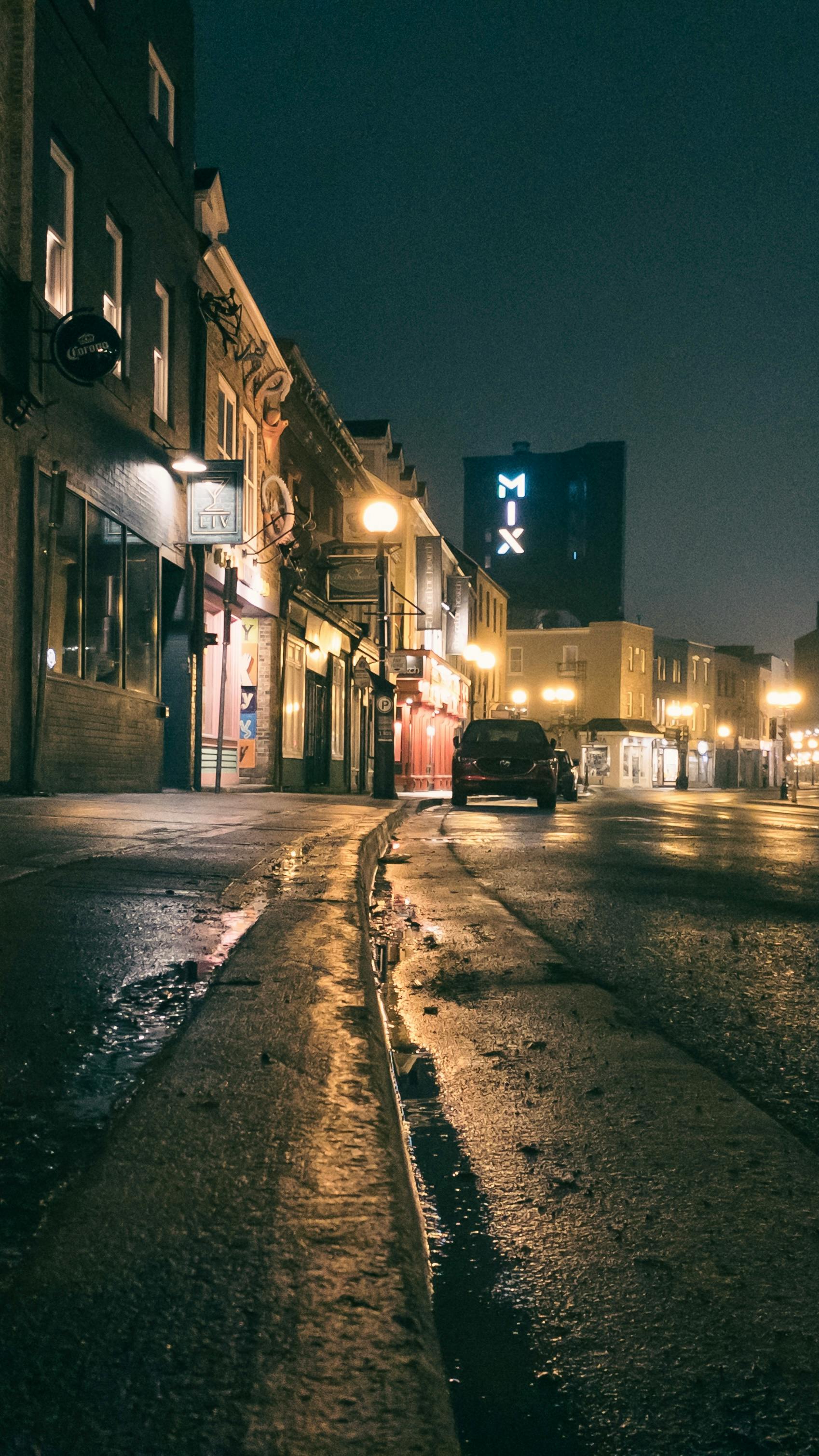 Explore the illuminated streets of St. John's at night with vintage charm and city vibes.