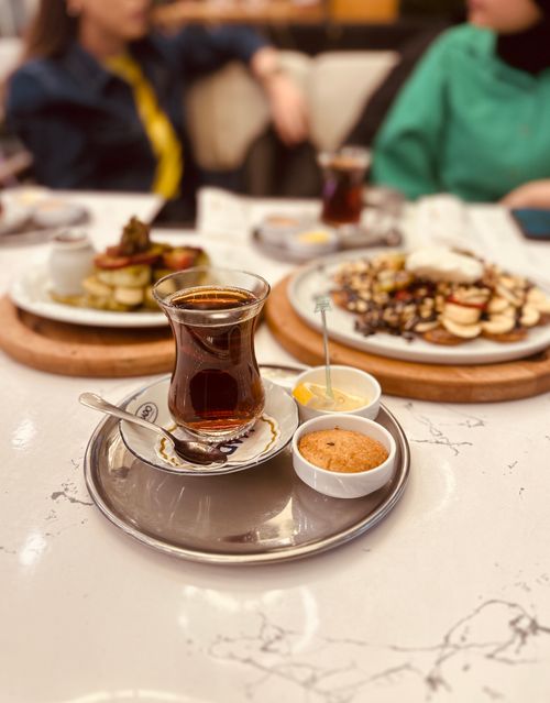 Free Close-up of Turkish tea with desserts in a cafe setting, Van Türkiye. Stock Photo