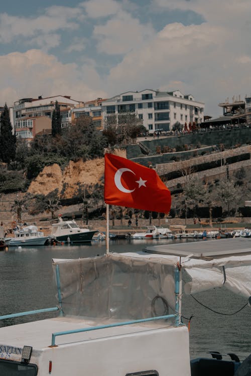 Turkish Flag on Motorboat on Shore