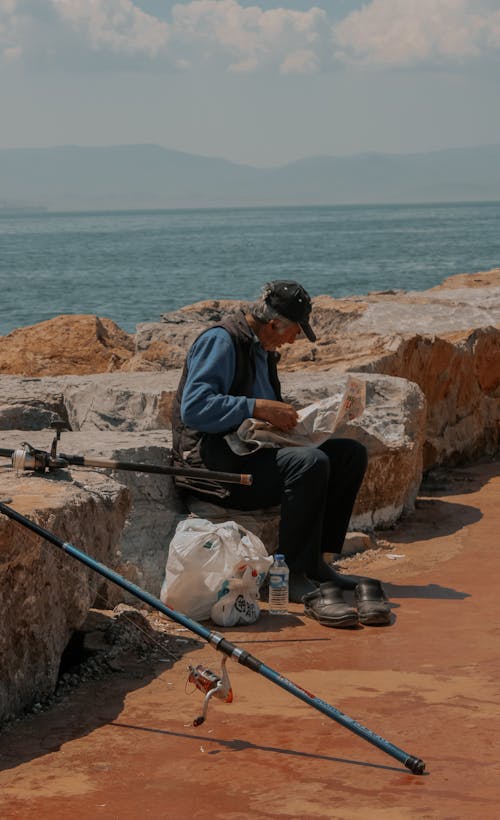 Fotos de stock gratuitas de cañas de pescar, hombre, mar