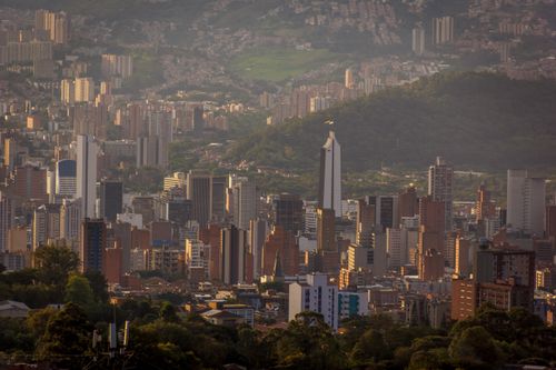 Free Aerial view of Bucaramanga, showcasing its vibrant skyline and surrounding hills at twilight. Stock Photo
