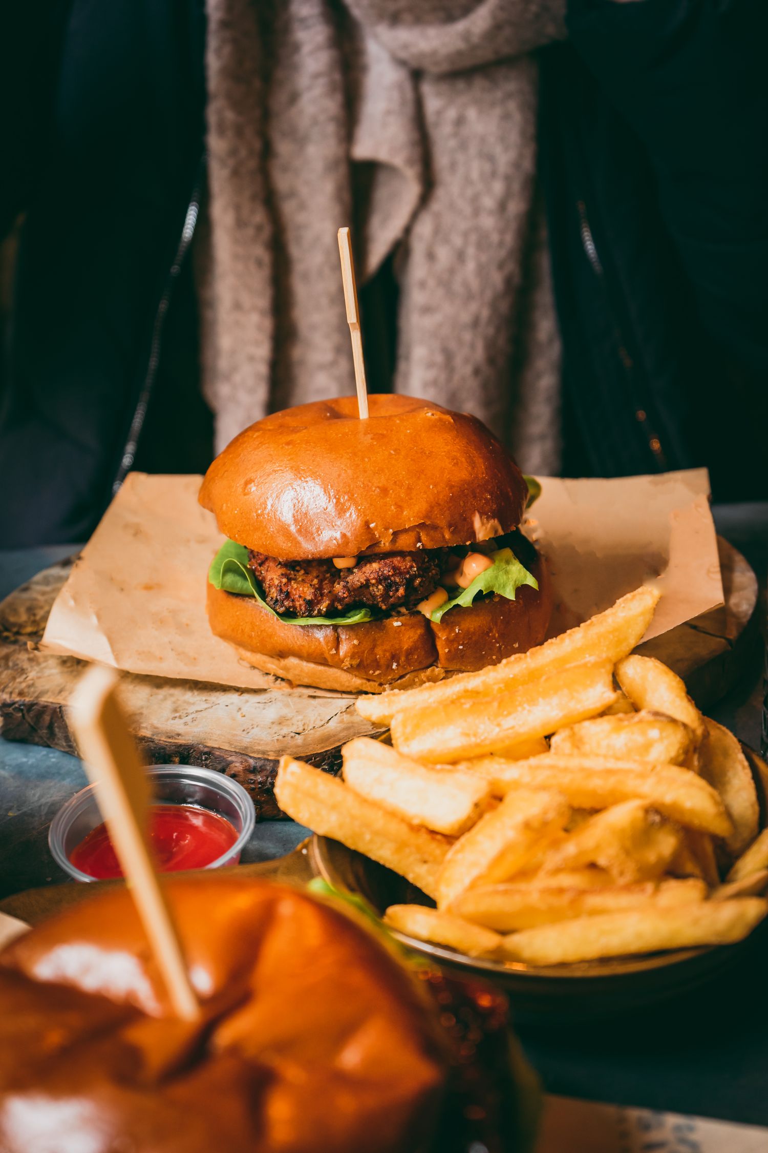 Burger and fries on wood