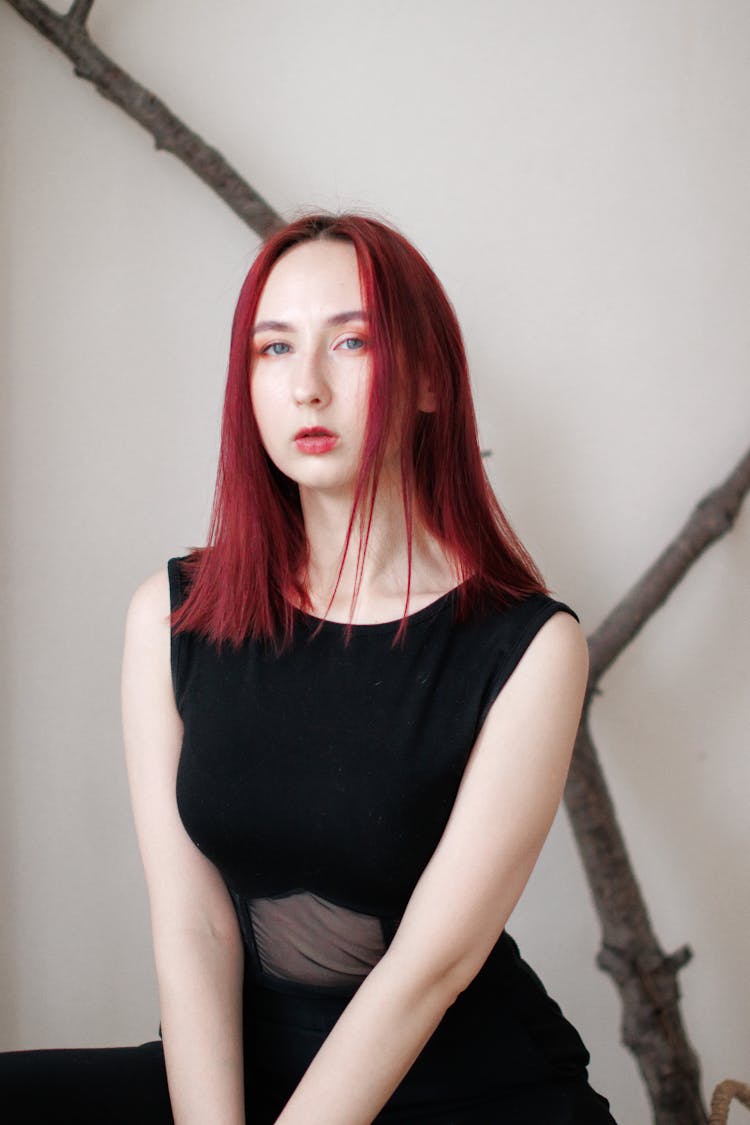 A Portrait Of A Woman Wearing Black Dress