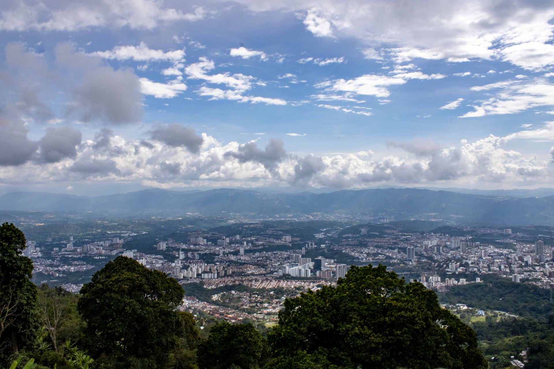 Stunning aerial view over Floridablanca, Colombia capturing urban life and lush greenery.