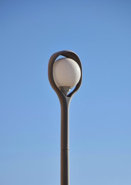 A Modern Street Lamp against Clear Blue Sky 