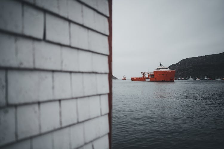 A Tug Boat Near The Shore In St John, Newfoundland, Canada 