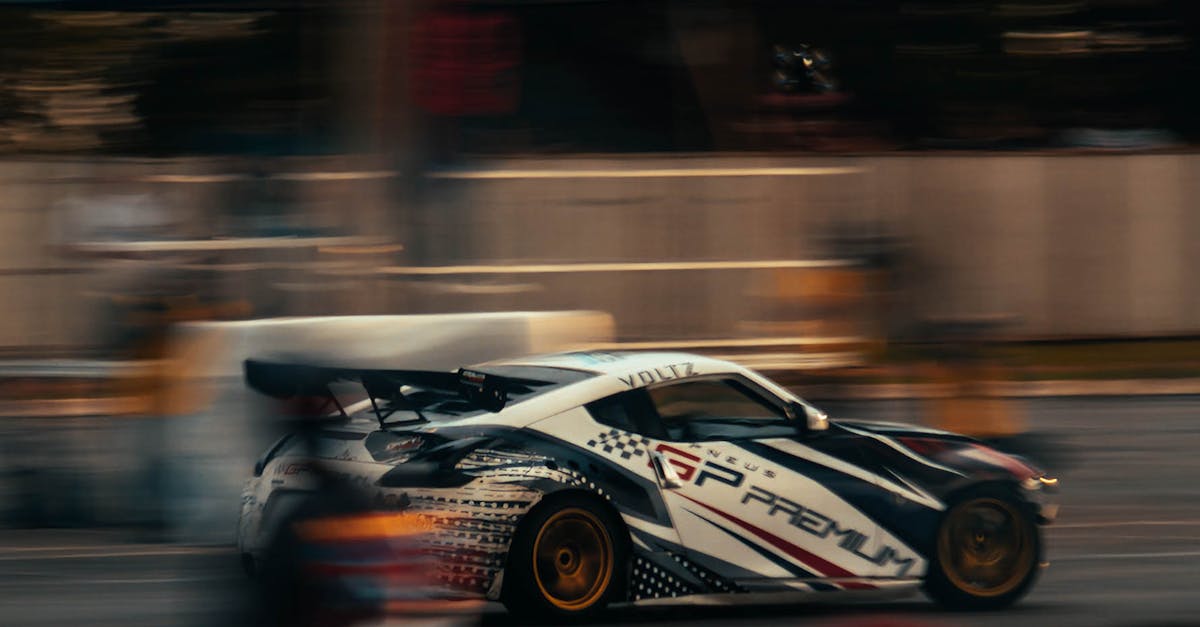 A car is racing down the street with blurry people · Free Stock Photo