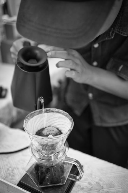 High angle view of a person brewing coffee with a pour-over method.