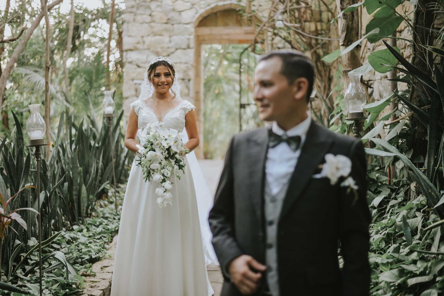 Menjaga Konsistensi Kualitas Rasa dan Standar Pelayanan Profesional untuk Setiap Acara 2 Bride and groom captured in elegant wedding attire amidst a lush botanical garden setting.