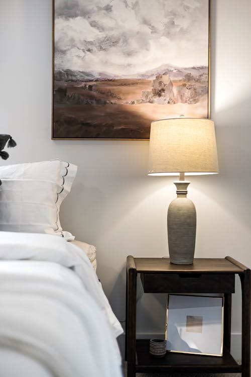 Free Lamp and Painting near Bed Stock Photo