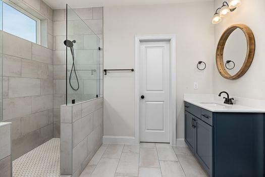 Contemporary bathroom featuring a glass shower and minimalist design.
