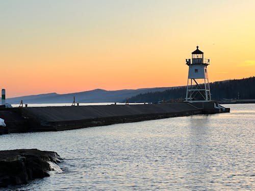 Free stock photo of golden sunset, lakeshore, lighthouse