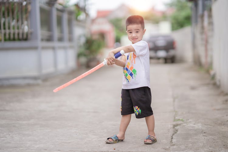 Boy With Toy Lightsaber