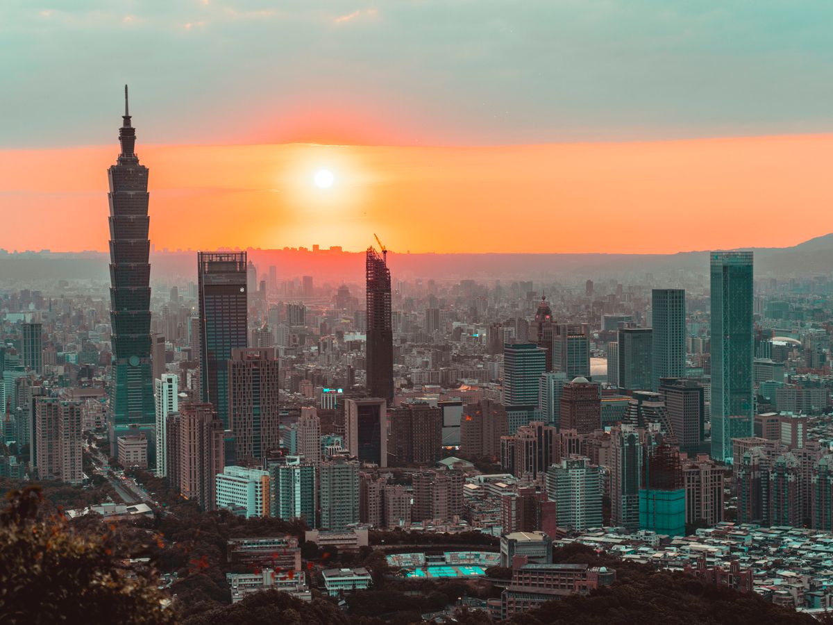 Taipei skyline at sunset with Taipei 101 towering above the city