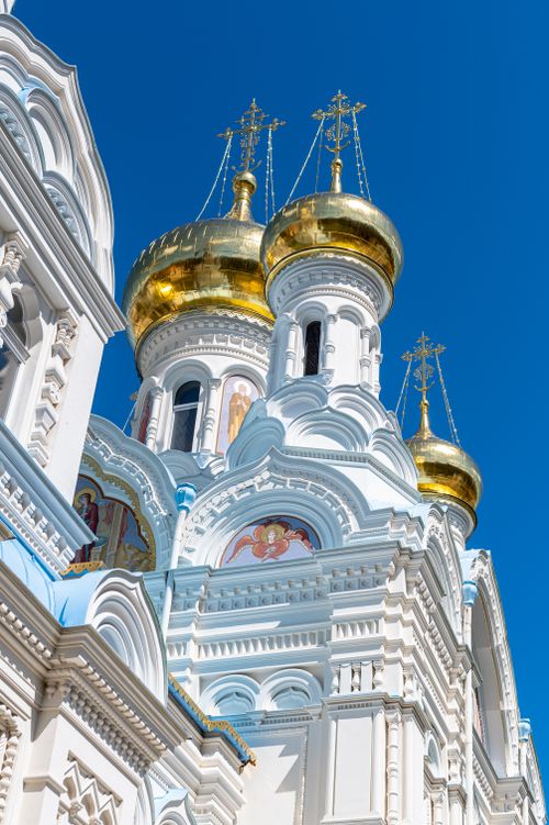 Free Sunlit golden domes of the Orthodox Church in Karlovy Vary, Czech Republic. Stock Photo