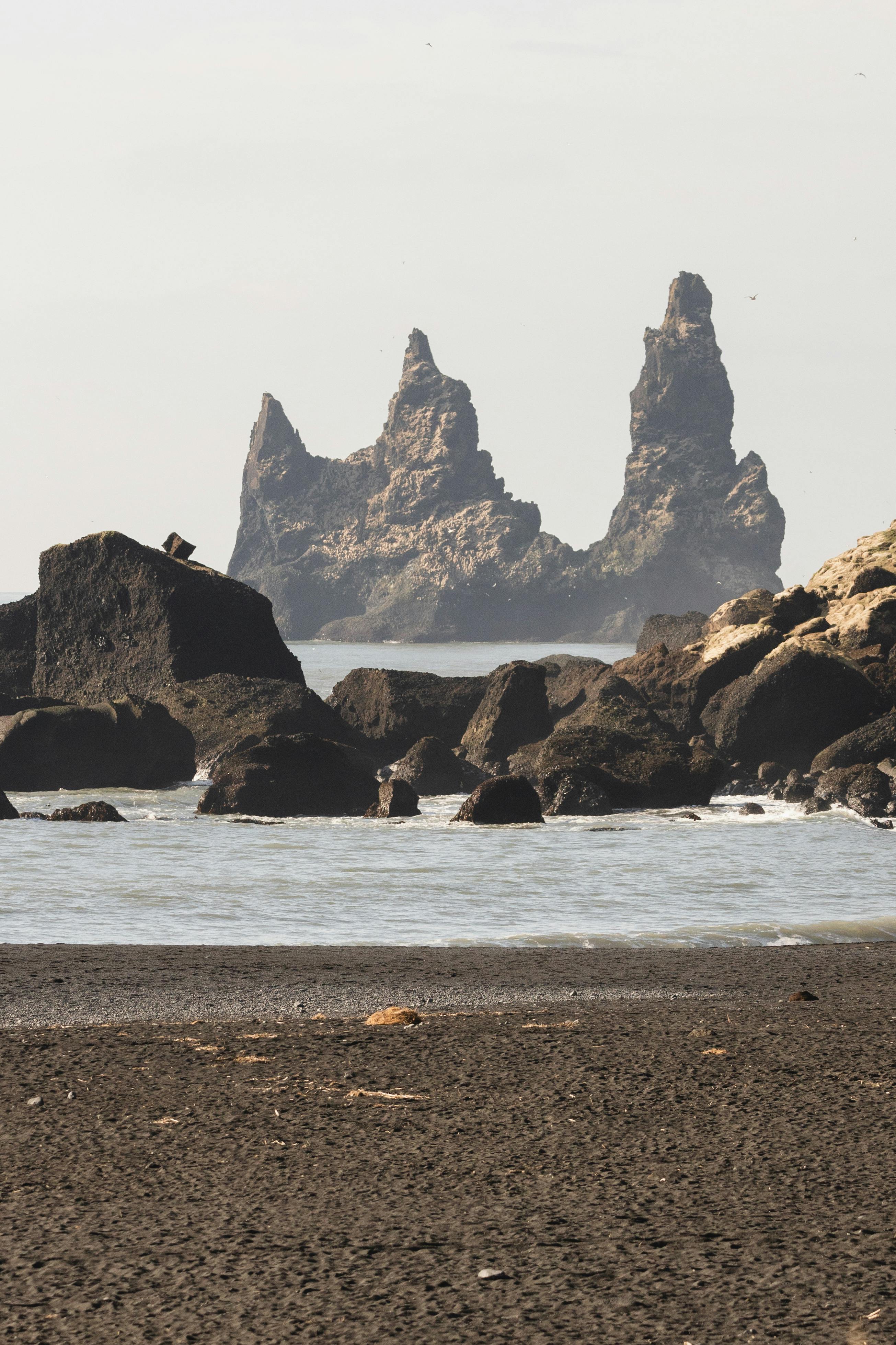 Cliff over Beach on Sea Shore · Free Stock Photo